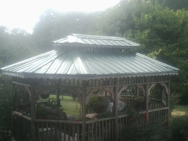 Two tier green metal roof on a garden gazebo in Grass Valley